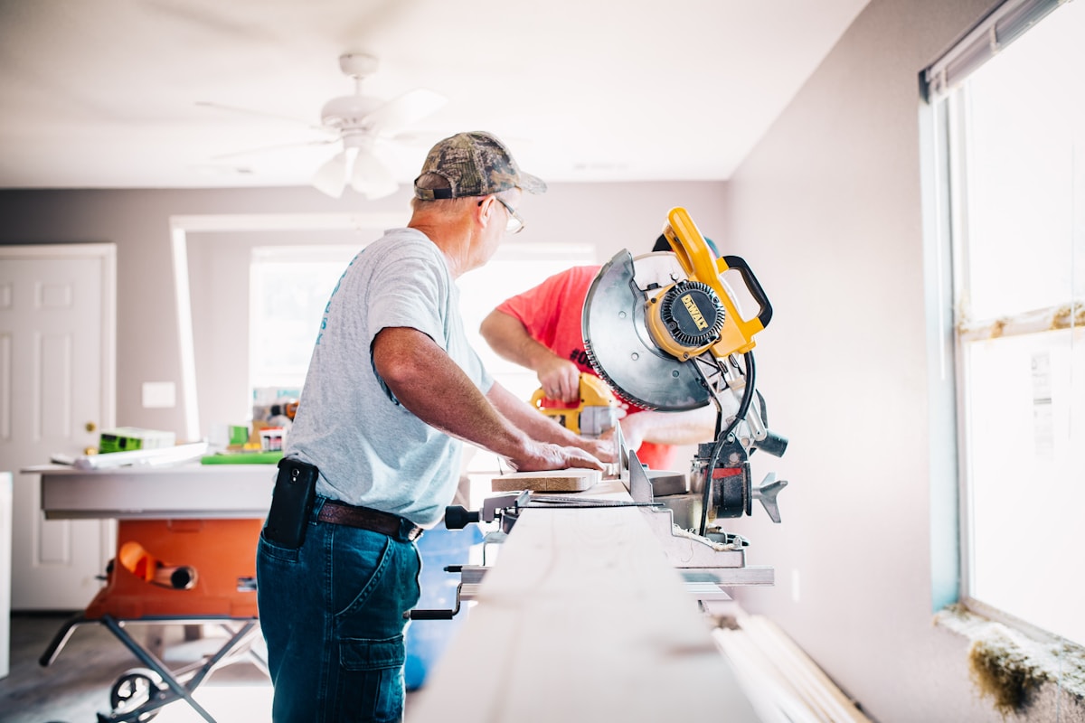 Contractor using a drill for property maintenance