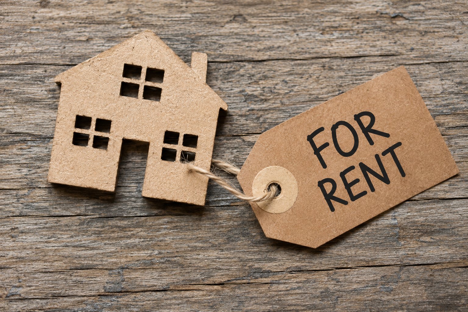 For rent tag and house cutout representing a Somerville rental prepared for new tenants